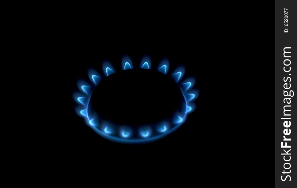 Flames of gas stove in the dark