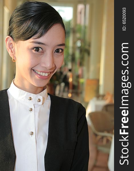 Beautiful Waiter at restaurant smiling. Beautiful Waiter at restaurant smiling