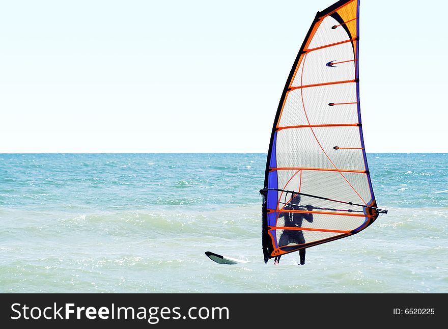 Silhouette of a windsurfer