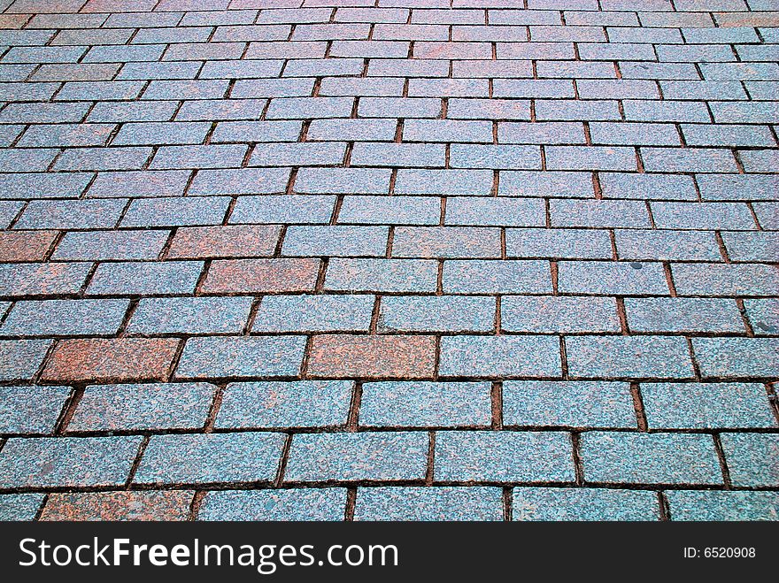 Rough texture of wet block pavement