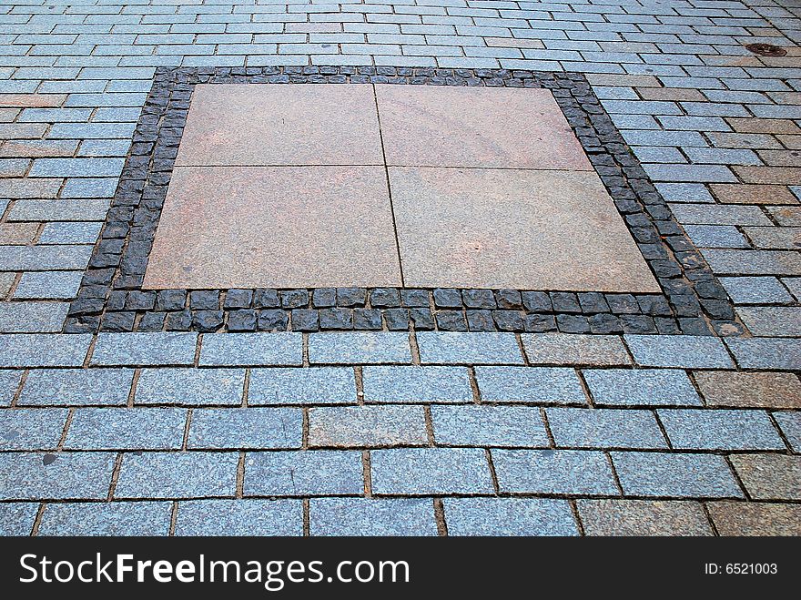 Rough texture of wet block pavement