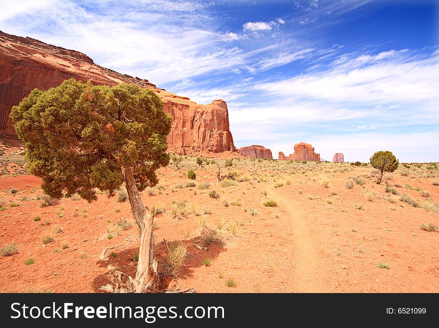 View of Monument Valley under a blue sky