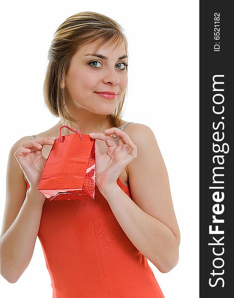 Young woman in red with red gift on white. Young woman in red with red gift on white