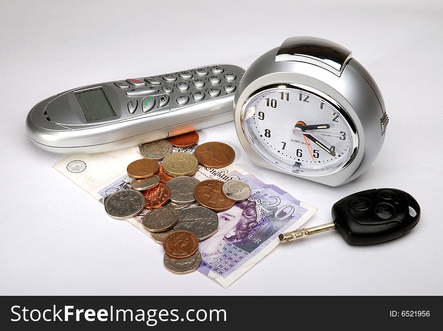 Items found on a bedside table on a white linen background.