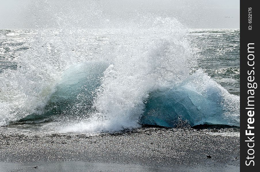 Splashing waves on bluegreen segments of glacier ice. Splashing waves on bluegreen segments of glacier ice