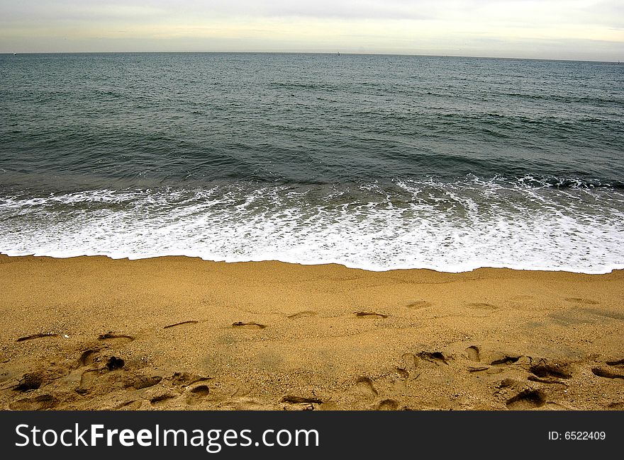 Dark sea with sand in winter time. Dark sea with sand in winter time