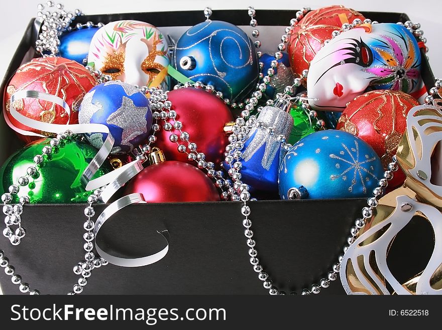 Colorful christmas bulbs, mask, beads and streamer boxed