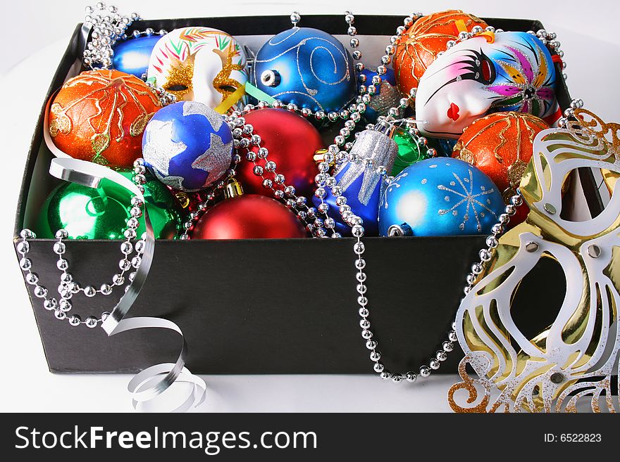 Colorful christmas bulbs, mask, beads and streamer boxed