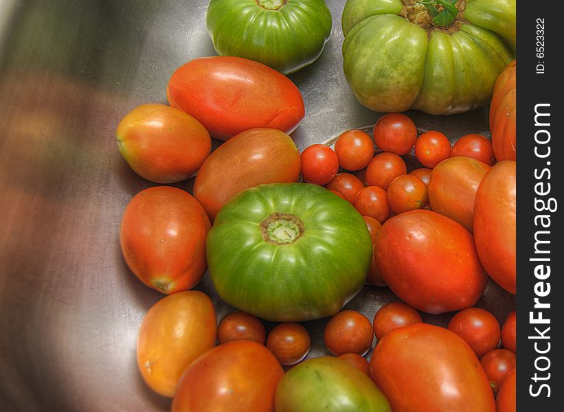 A variety of garden tomatoes ready to be used in various homemade recipes.