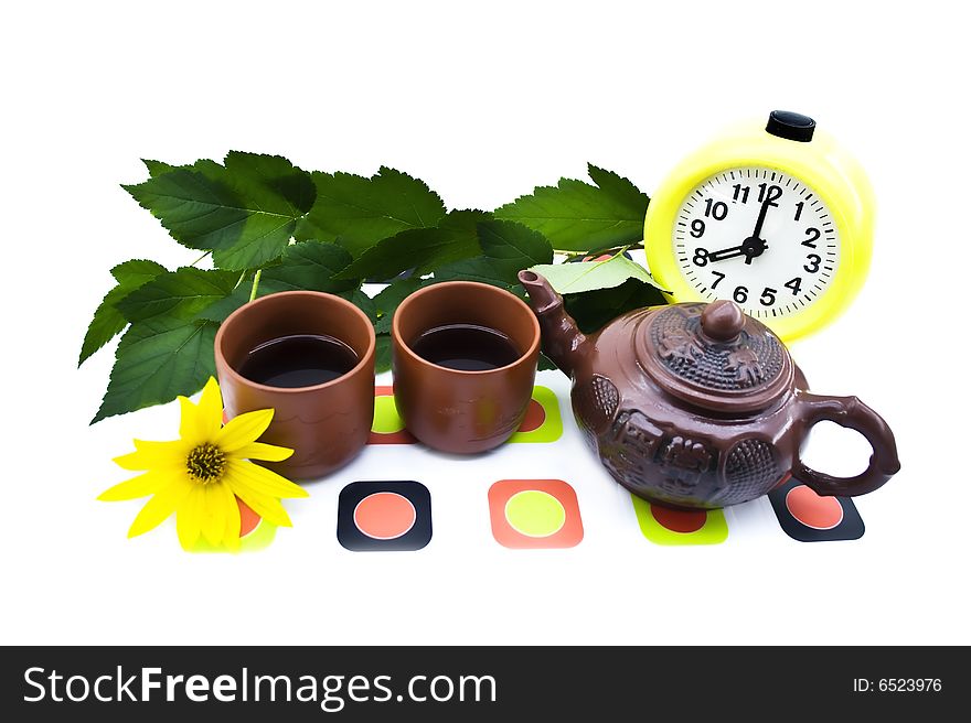 Clay teapots and cups isolated on a white background