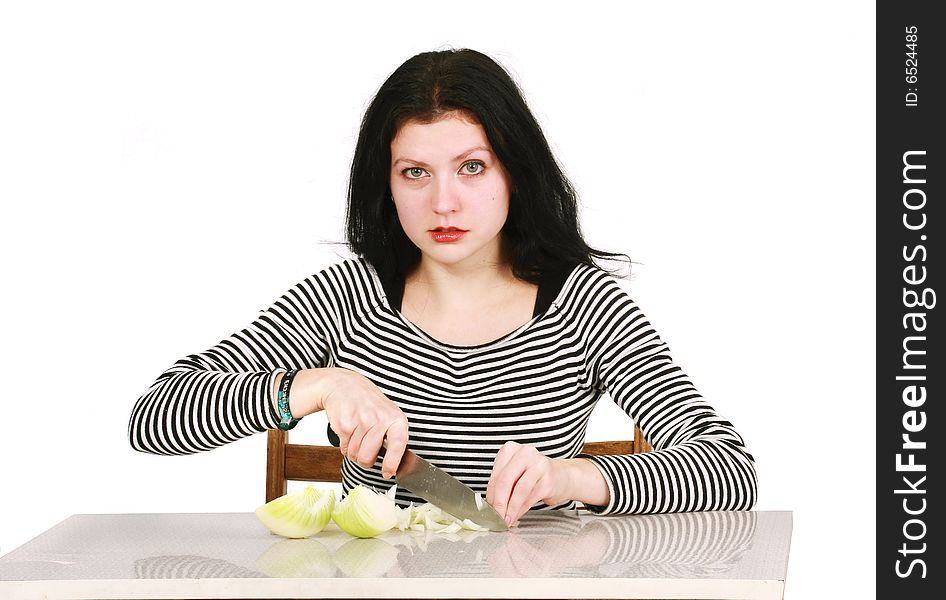 Woman cutting onion in the Kitchen. Woman cutting onion in the Kitchen