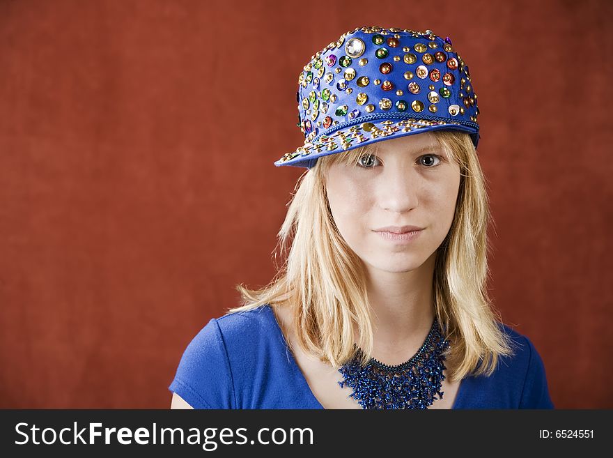 Teenage girl wearing a hat with sequins