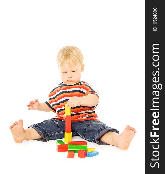 Beautiful young child playing intellectual game. Isolated on white background