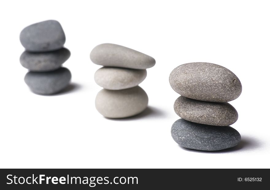 Stack of balanced stones on white. Stack of balanced stones on white
