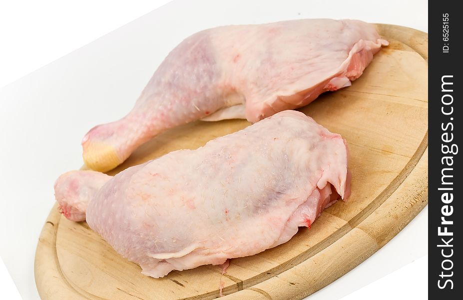 Fresh chicken legs-drumsticks-on the cutting board