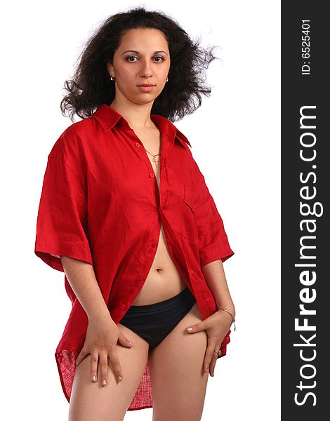 Curly-headed girl in red male shirt posing