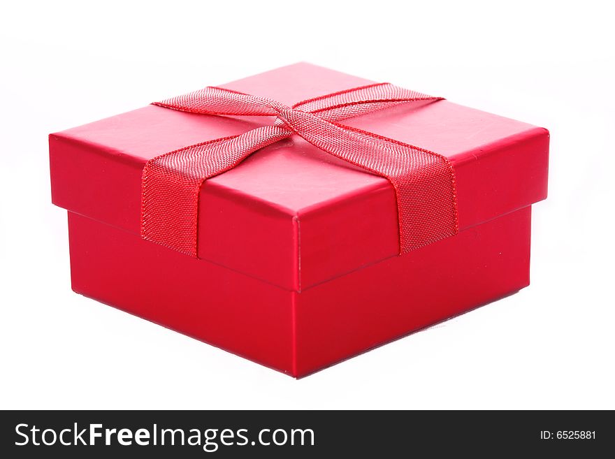 A red giftbox isolated on white. A red giftbox isolated on white