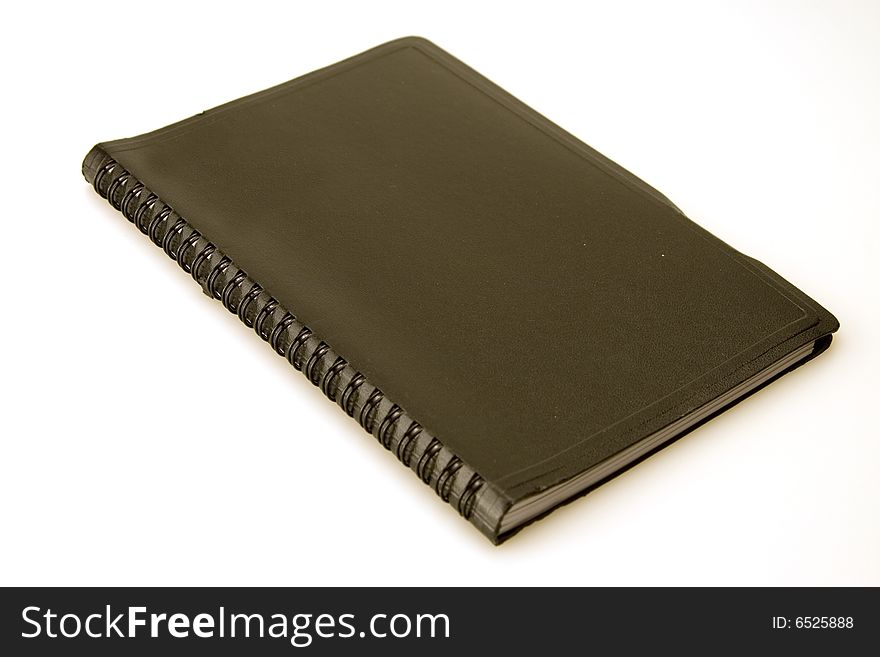 Black covered spirel bound closed date book