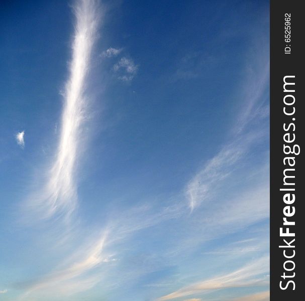 Some very wispy clouds high in the sky. Some very wispy clouds high in the sky.