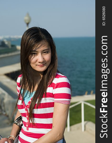 Young Asian Woman in the park by Lake Michigan, Chicago