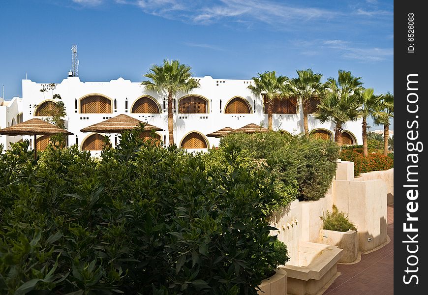 Building and palm trees in resort