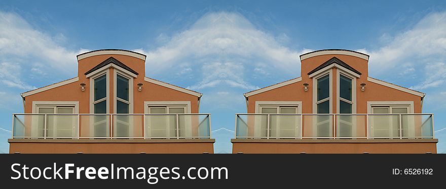 Mirrored beach house against blue sky with clouds. Mirrored beach house against blue sky with clouds