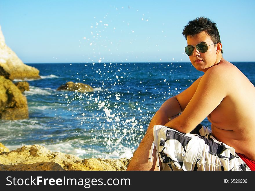 Young man next to sea.