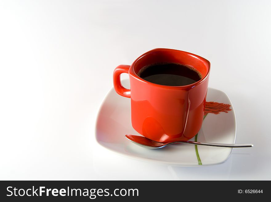 Isolated(with gentle refletion) cup of black coffee with spoon. Isolated(with gentle refletion) cup of black coffee with spoon.