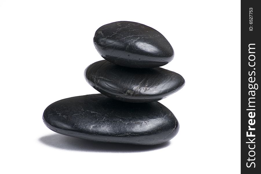 Three stacked stones isolated on white background