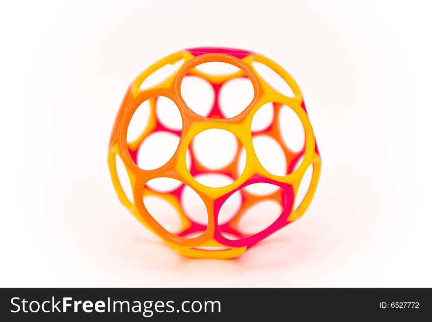 A plastic ball with holes isolated on a white background