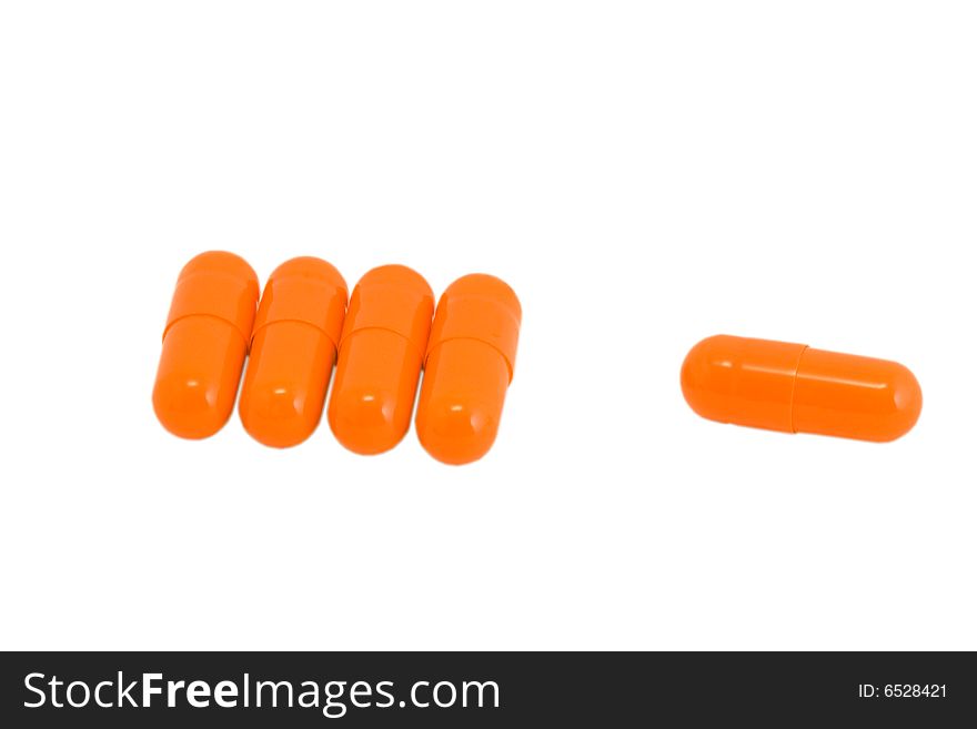 Vitamin pills on isolated white background