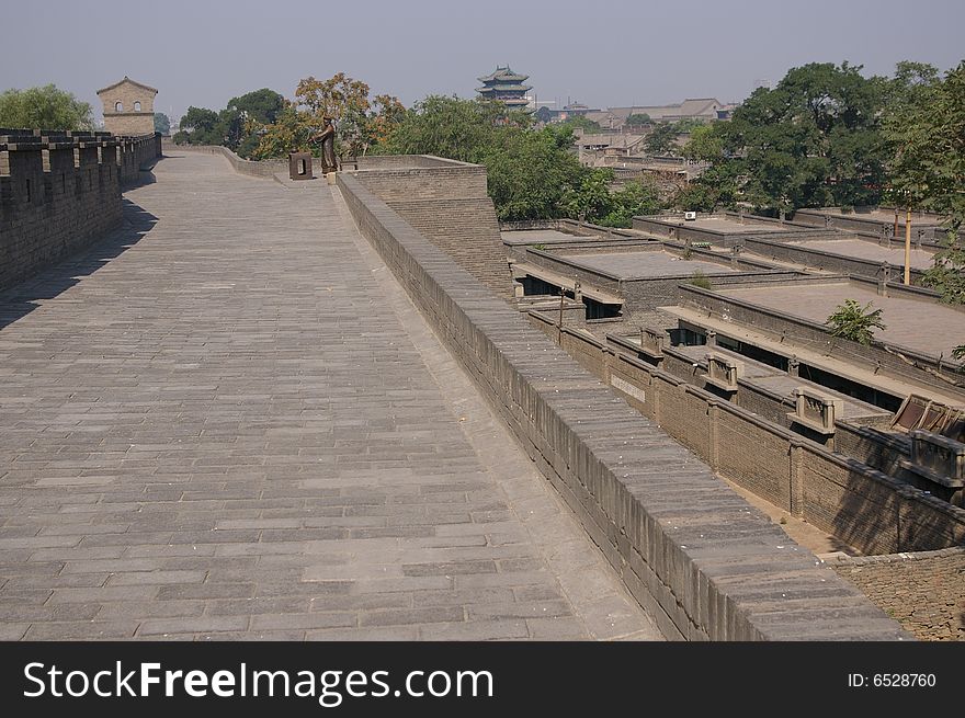 Ancient city Pingyao in China,old rampart and trees in the city. Ancient city Pingyao in China,old rampart and trees in the city.