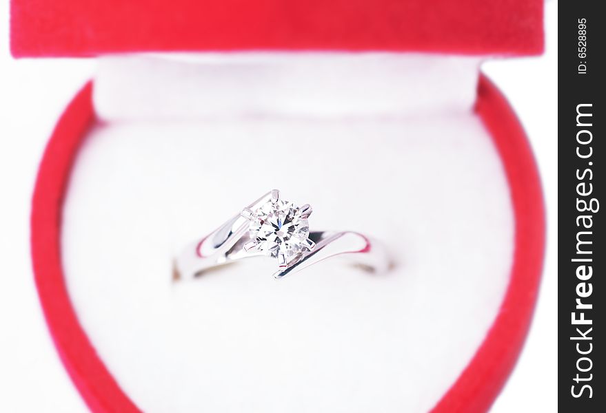 Close-Up Of Engagement Ring In Red Box, Top View
