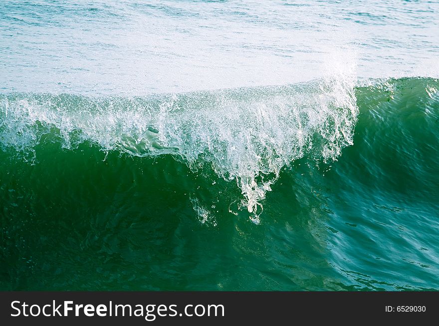 Sea wave. Heavy wave crashes.