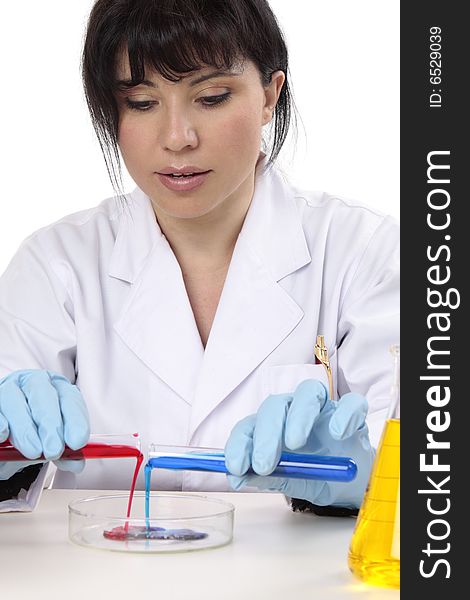 A scientist using test tubes and petri dish in a laboratory. A scientist using test tubes and petri dish in a laboratory.