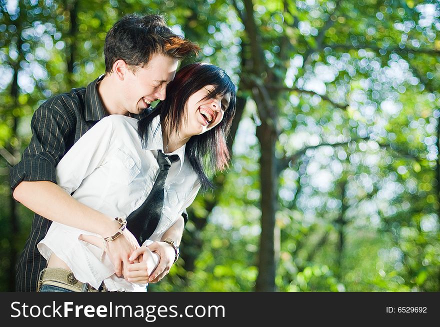 Young beautiful couple laughing outside. Young beautiful couple laughing outside