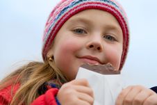 Young Girl Eats Chocolate Royalty Free Stock Photos Young Girl Eats Chocolate Royalty Free Stock Photos