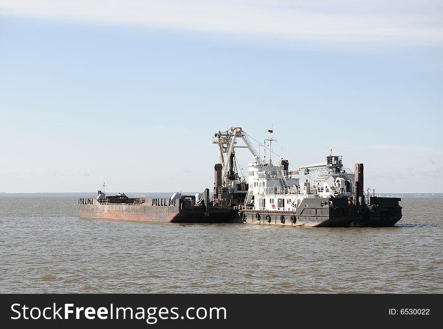 Dredger works in gulf of Finland of Baltic sea. Dredger works in gulf of Finland of Baltic sea.