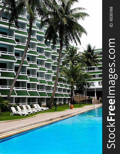 Tropical resort buildings and swimming pool.