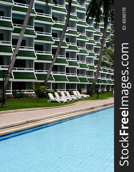 Tropical resort buildings and swimming pool.