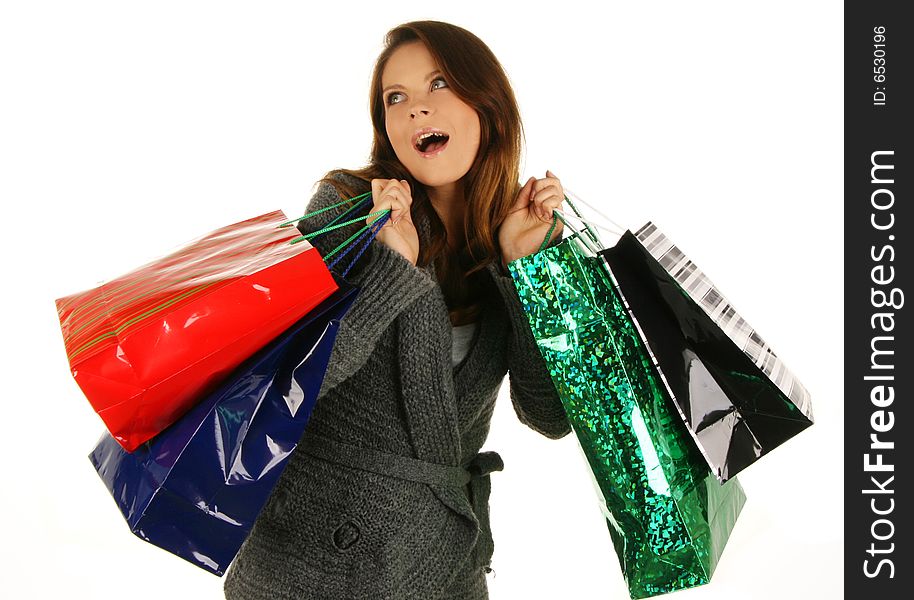 Shopping happy woman. Isolated over white background.