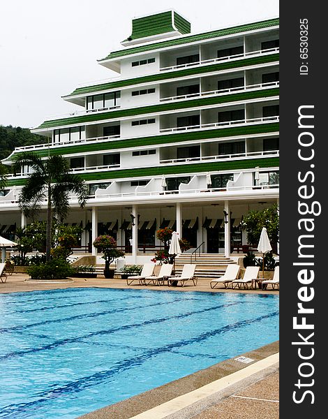 Tropical resort buildings and swimming pool.