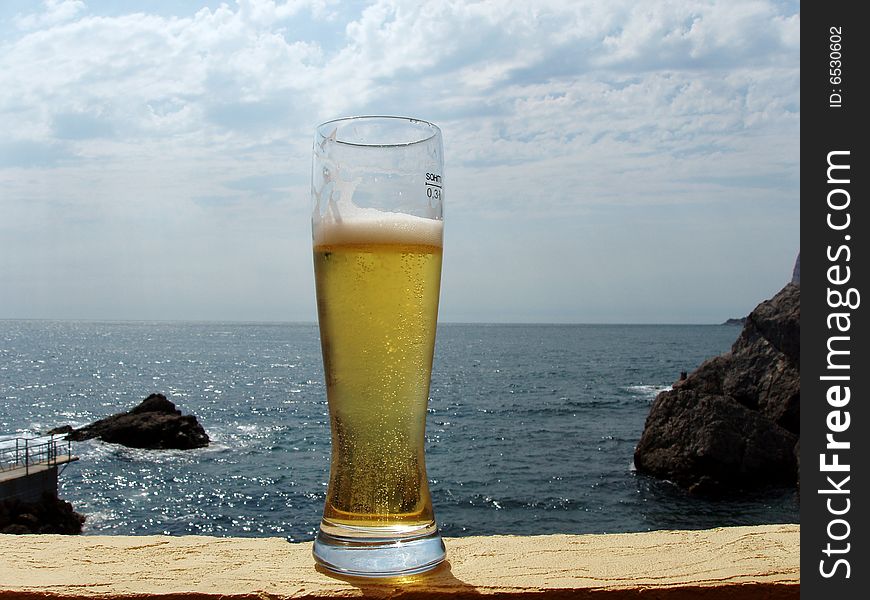 Beer glass at the beach