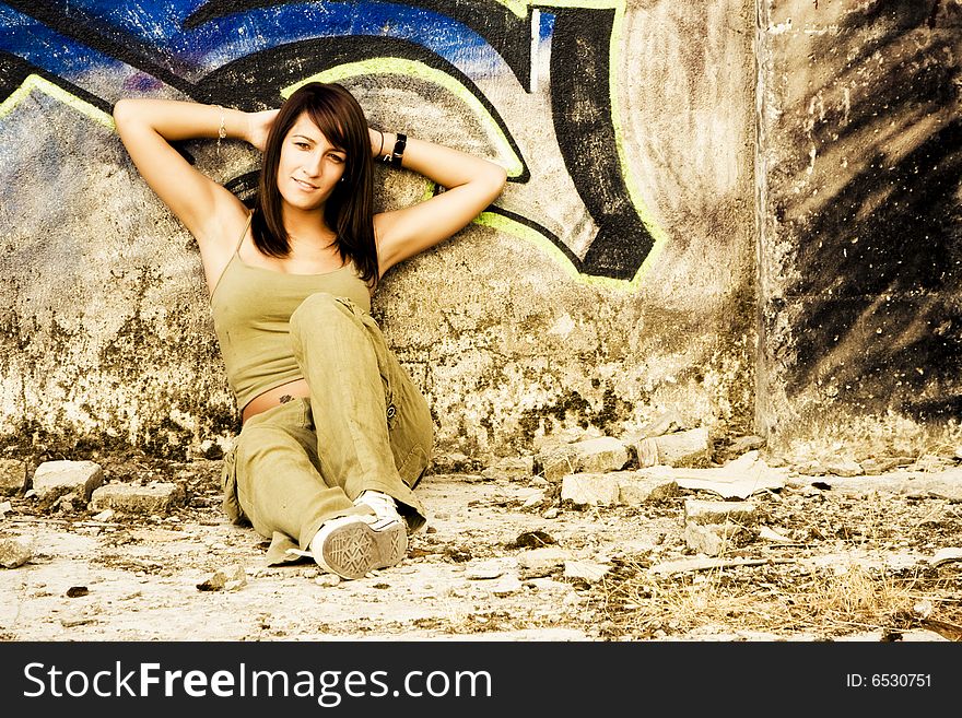 Young woman in casual clothing staring at camera.