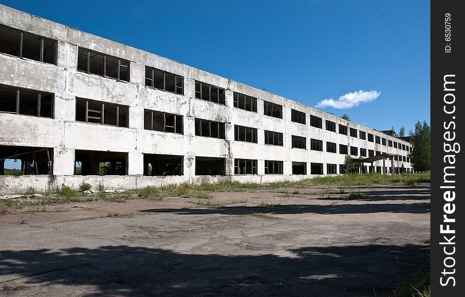 Abandoned building with broken windows. Perspective view