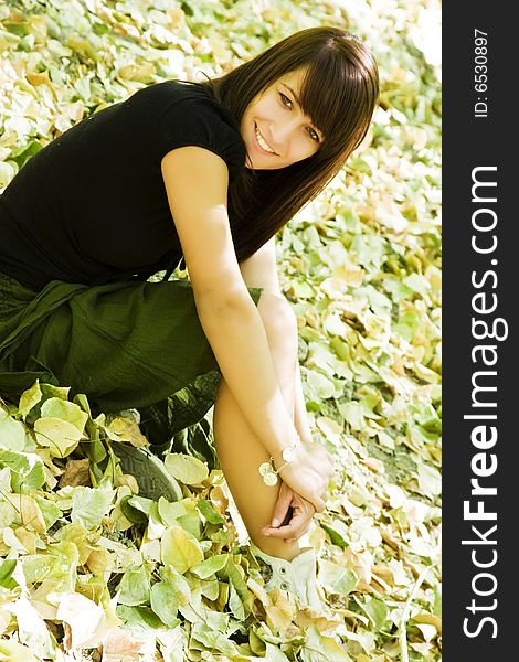 Young Woman In Autumn Background