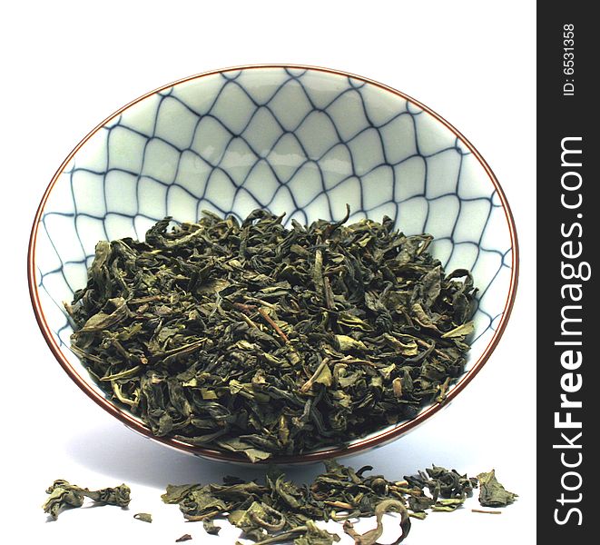 China tea bowl witg green tea leavs. China tea bowl witg green tea leavs