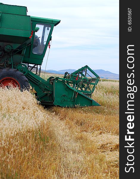 Combine on a background of a field