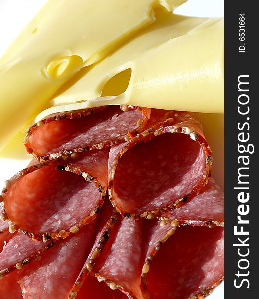 Salami and cheese on plate