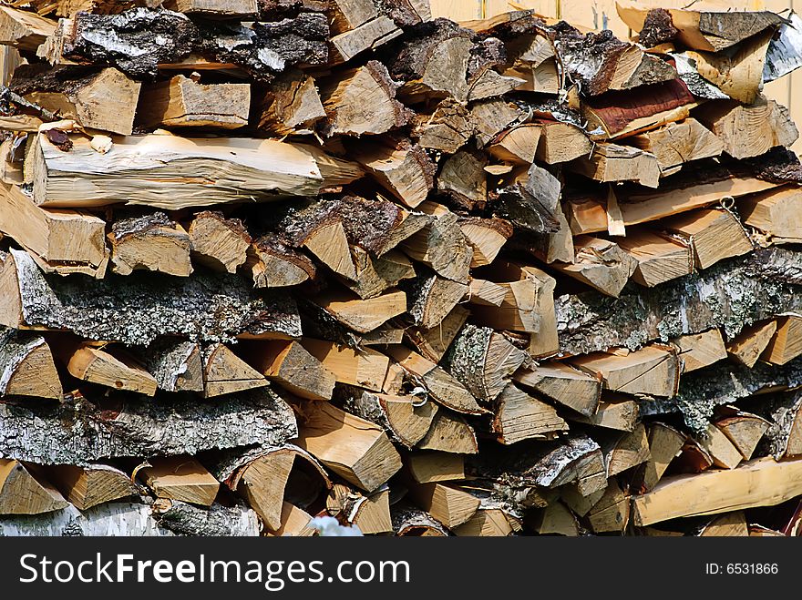 Stack of firewood birch in farm closeup. Stack of firewood birch in farm closeup